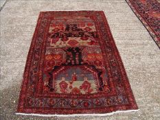 A Hamadan wool rug The midnight blue field extensively filled with geometric motifs within