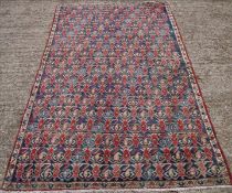 An Afshar wool rug The midnight blue field extensively filled with repeat motifs within a stylised