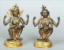 Two 18th/19th century painted and silvered bronze models of Indian deities, possibly Shiva Each