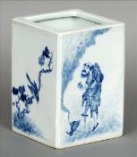 A Chinese blue and white porcelain brush pot Of square section, decorated with figures and branch