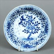 A Chinese blue and white porcelain dish The interior decorated with birds within floral sprays, blue