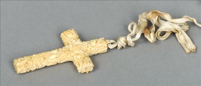 A 19th century carved ivory cross form pendant Carved overall with flowering foliage. 8.5 cms