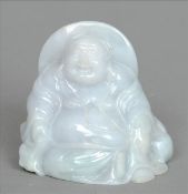 A Chinese carved jade pebble Modelled as a seated Buddha, standing on an associated carved and