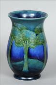 A Moorcroft Moonlit Blue pattern vase The flared rim above the bulbous body, typically decorated