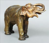 A 19th century Continental porcelain model of an elephant, probably amphora Naturalistically