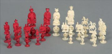 A late 19th/early 20th century Chinese stained ivory chess set Each piece of carved figural form,