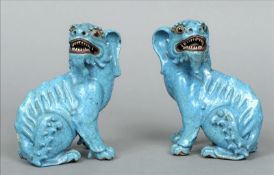 A pair of Chinese pottery models of qilins Each typically modelled in a turquoise glaze. 19 cms