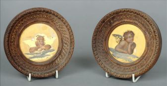 Two 19th century framed Continental paintings of putti Each set on a gilt background. 12.5 cms