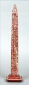 A Grand Tour carved rouge marble obelisk Of typical form, carved with various hieroglyphs,