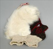 A Peruvian knitted lama wool child`s mask The hair represented by guinea pig pelt or Peruvian arctic