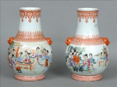 A pair of Chinese Republic Period porcelain vases Each of bulbous form with twin mask handles and