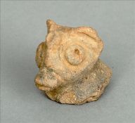A Pre-Columbian pottery pot handle Modelled as a dog`s head. 5 cms high. Generally in good