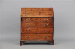 A Georgian yewwood bureau The rectangular fall enclosing an arrangement of drawers, pigeon holes and