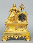 A 19th century ormolu mantle clock Surmounted with a young lady beside a bouquet of flowers above