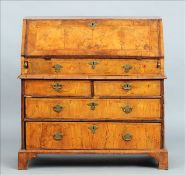 An 18th century burr walnut two part bureau The feather banded rectangular top above the feather