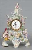 A 19th century Continental porcelain cased mantel clock, possibly Meissen Of scrolling floral