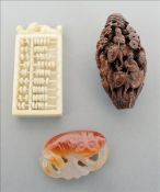 A late 19th/early 20th century Cantonese carved ivory miniature abacus Together with a small