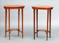 A pair of Edwardian line inlaid satinwood side tables Each oval top supported on square section