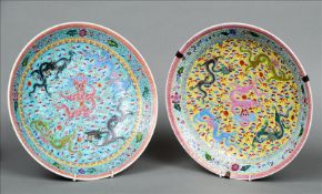 A pair of Chinese enamel decorated porcelain plates Each centrally decorated with five various