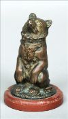 A 19th century bronze inkwell Formed as a collared bear, the head hinged to reveal a recess,