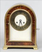 An early 20th century tortoiseshell cased mantle clock The brass bound domed case centred with a