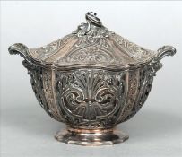 A French silver sucrier The twin handled pierced body with an inset glass liner and a removable