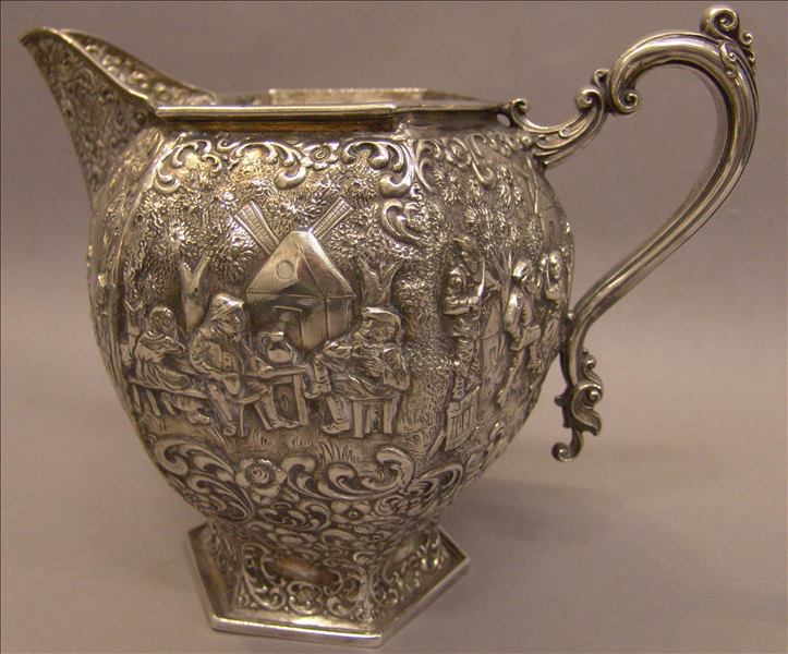 A 19th century Continental, possibly Dutch, silver plated jug The repousse hexagonal body