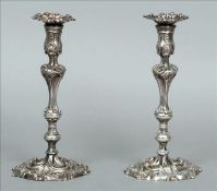 A pair of George III silver candlesticks, hallmarked London 1813, maker`s mark of WI Modelled in the