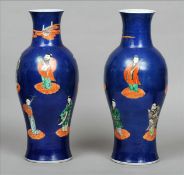 A pair of 19th century Chinese vases Each with a deep blue ground and decorated with figures in