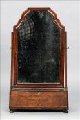 An 18th century and later walnut dressing table mirror The shaped rectangular mirror plate in a