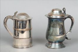 Two Old Sheffield plated lidded tankards One with a gadrooned domed lid and pierced scrolling