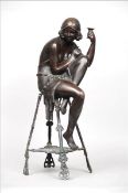 E. PIZZA (early 20th century) An Art Nouveau Model of a Young Lady, seated with a glass in her
