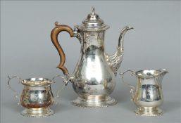 A George V silver coffee pot, hallmarked Birmingham 1919, maker`s mark indistinct Together with an