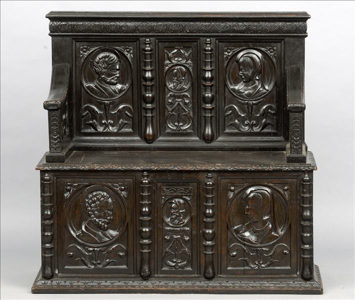 A 16th century and later carved oak settle The 19th century carcase inset with three 16th century