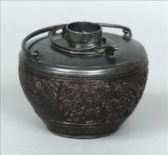 A 19th century Chinese wine pot Carved from a coconut with pewter mounts. 12.5 cms wide. Lid