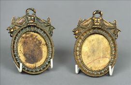 A pair of 19th century bronze miniature frames Each with scrolling crested tops above a bead