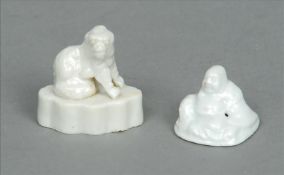Two 18th century Chinese blanc de chine miniature figures One of Hoteh, the other a seated dog.