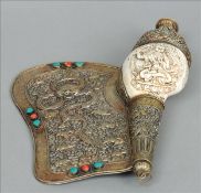 A 19th century Tibetan unmarked white metal and turquoise mounted conch shell horn 20 cms long. Some