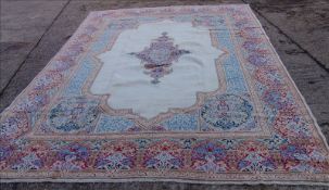 A Kirman wool carpet 420 x 292 cms. Generally in good condition, expected wear.