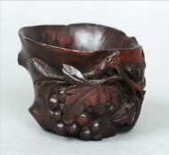 A late 19th/early 20th century Chinese carved wooden brush pot The shallow cylindrical vessel carved