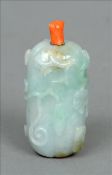 A 19th century Chinese light green jade snuff bottle Carved in the form of a fruit with a red