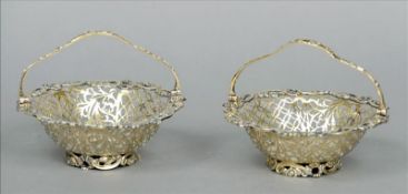 A pair of Victorian silver gilt sweetmeat baskets, maker`s mark of Richard Martin and Ebenezer
