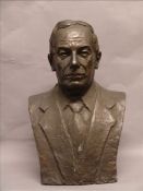 A large bronze bust Formed as a suited man with inscribed signature. 70 cms high. Overall good, some