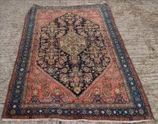 A Malayer wool rug The midnight blue field enclosing a central pole medallion within herati