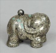 An unusual Chinese silvered bronze snuff bottle Formed as an elephant with a ball finial stopper,