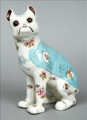 A late 19th century Continental pottery model of a French bulldog Decorated with flowers and wearing