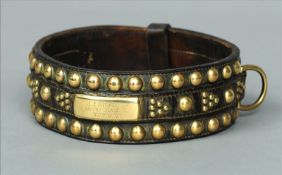 A 19th century brass studded leather dog collar The stitched bound leather with applied brass