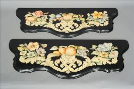 A pair of painted black slate console table tops Each of shaped serpentine form and decorated with