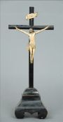 An 18th/19th century carved ivory Corpus Christi Modelled attached to a carved wooden cross