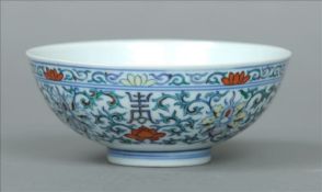 A 19th century underglaze blue and polychrome bowl Decorated with formal flowers and foliage, six